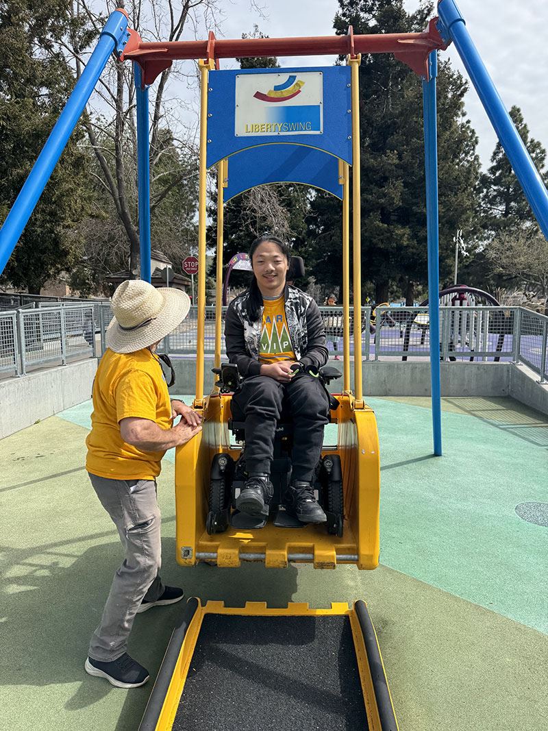 Man in wheelchair tries out the Liberty Swing
